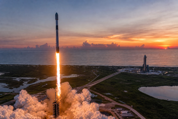 SpaceX Falcon 9 launching from Florida coast while Starship stands nearby at dusk