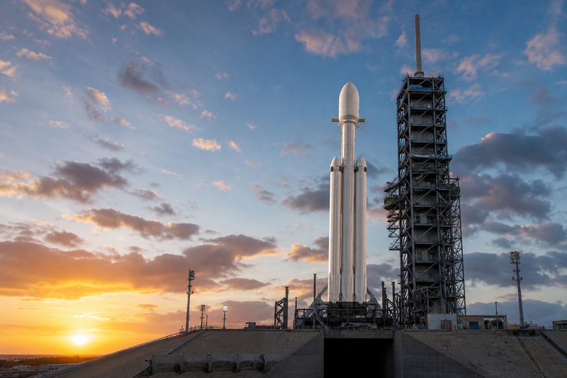 SpaceX Falcon Heavy rocket with NASA Roman Space Telescope payload on pad at dawn