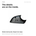 Interior of the Model Y left lower mirror cover showing molded retaining tabs, ribs and shaped inner edges