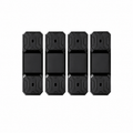 Four black rectangular electronic sensors or trackers with textured geometric patterns on the top and bottom halves, arranged in a row on a plain white background.