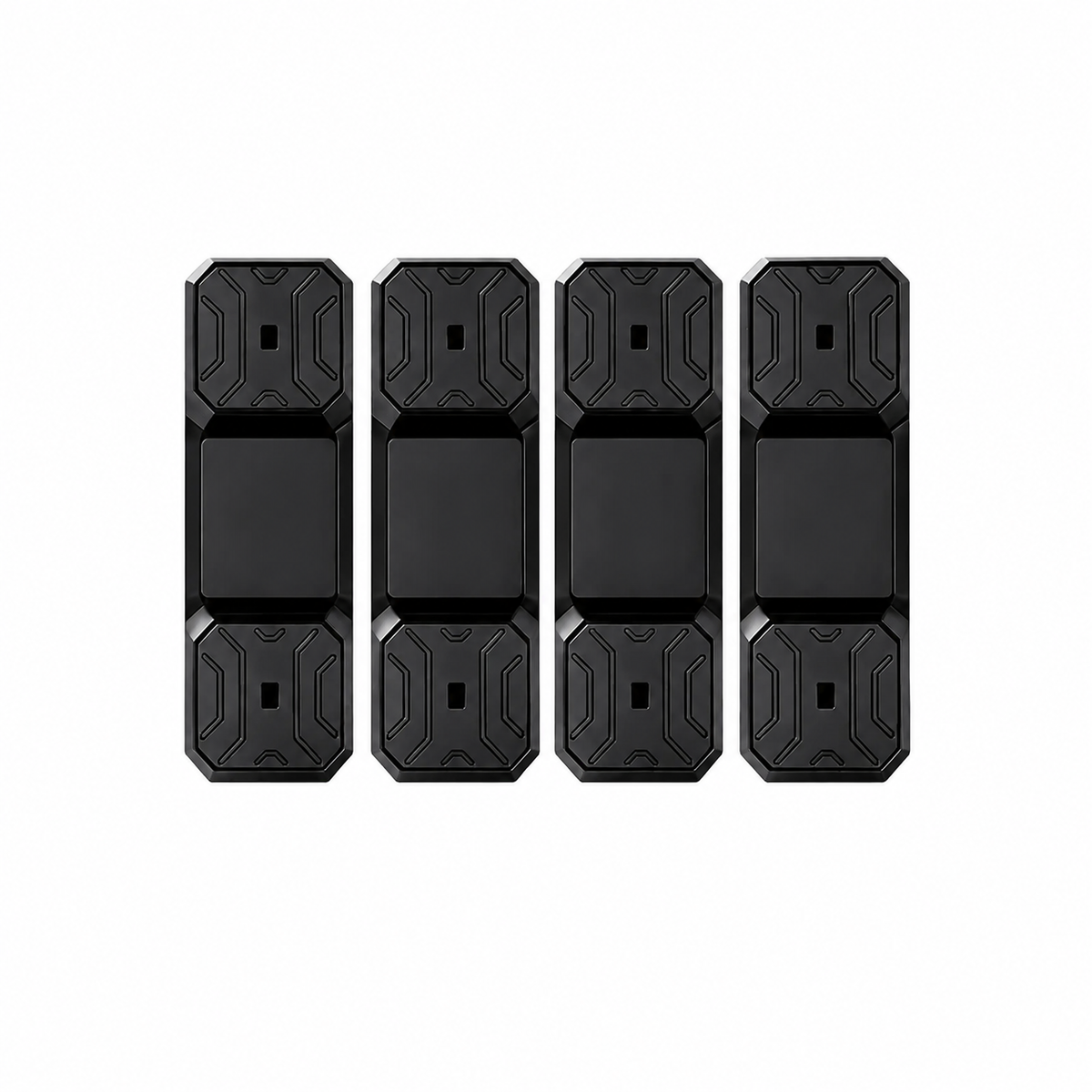 Four black rectangular electronic sensors or trackers with textured geometric patterns on the top and bottom halves, arranged in a row on a plain white background.