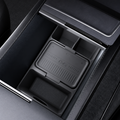 A dark gray silicone center console organizer tray shown installed inside a black car console compartment.