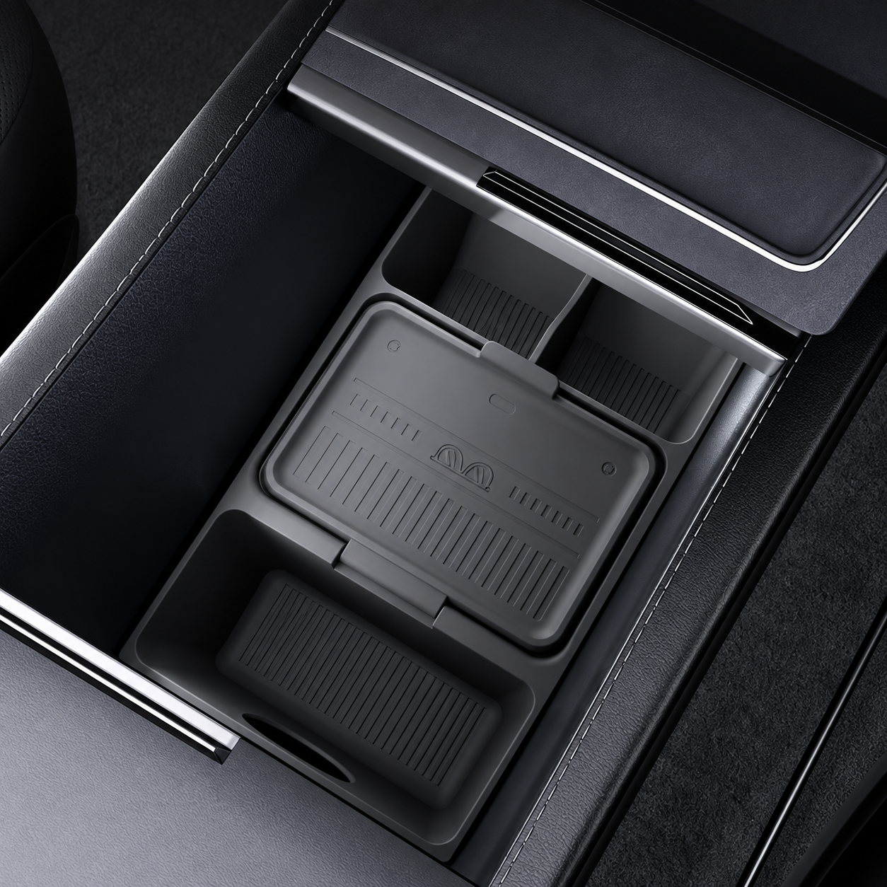 A dark gray silicone center console organizer tray shown installed inside a black car console compartment.