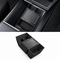 A black silicone car center console organizer tray shown installed inside a console and also as a standalone product shot on a white background.