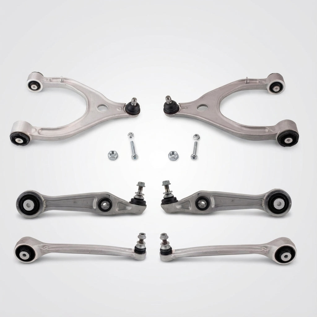 Set of automotive control arms and links on a white background
