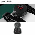 Jack pad positioned at a vehicle lifting point, with a set of four pads in a zippered storage case.