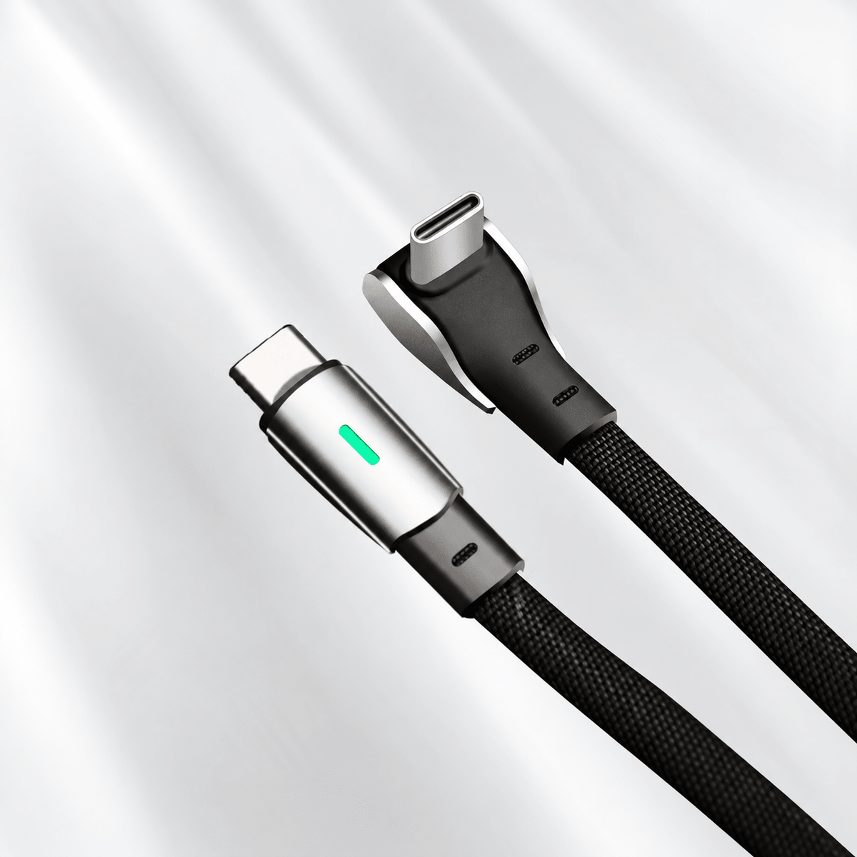 Two USB-C plugs with braided black cable jackets, including a right-angle connector and a green indicator.