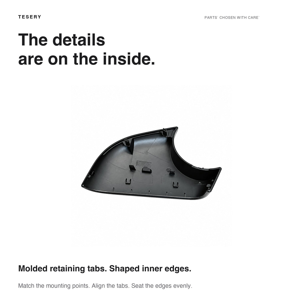 Interior of a lower mirror shell showing molded retaining tabs and shaped inner edges