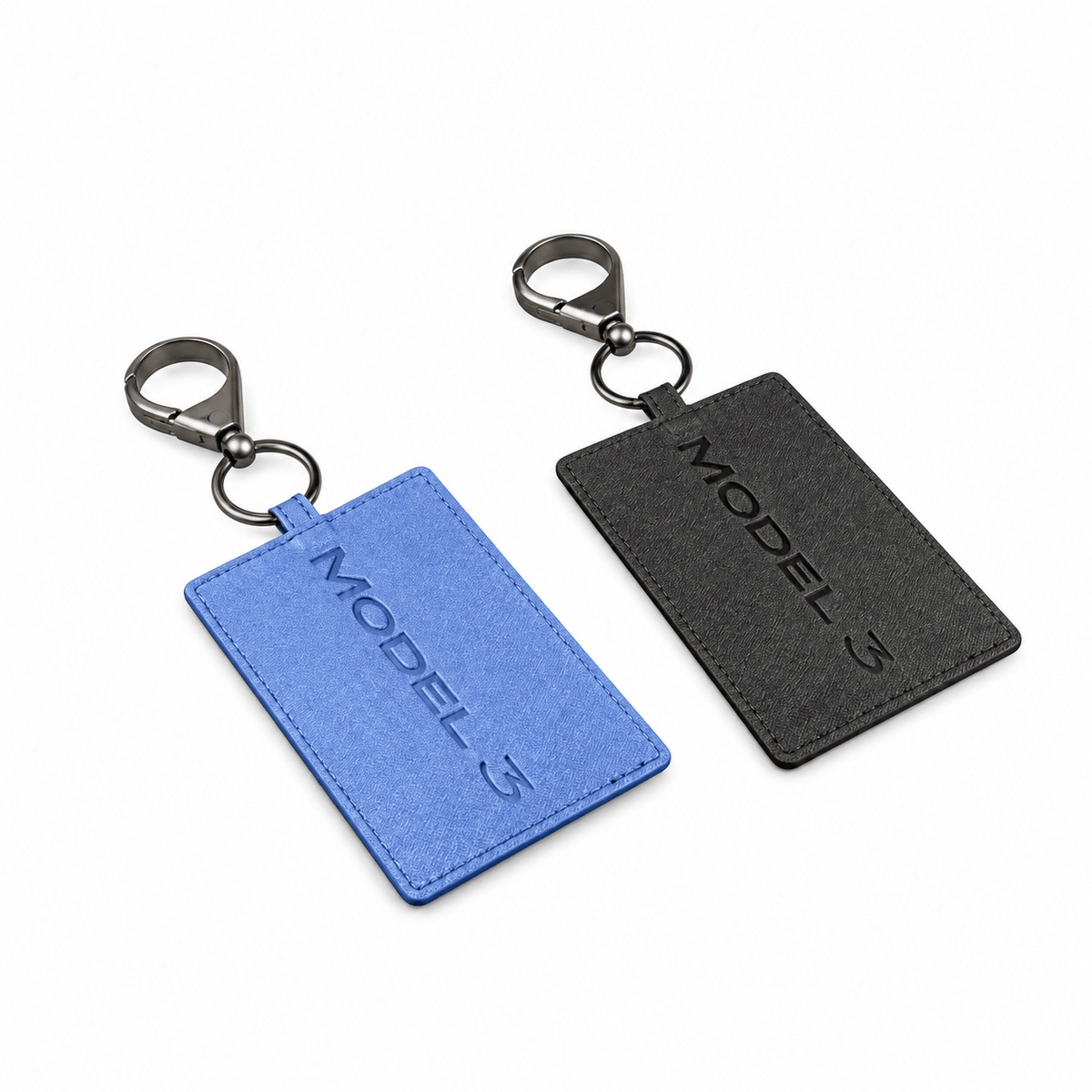 Blue and black textured key card covers with metal clips and embossed MODEL 3 lettering.