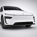 Wide front view showing carbon-fiber accents around the lower bumper corners