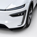 Front corner view showing lower carbon-fiber trim and a separate lamp surround