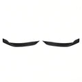 Pair of curved carbon-fiber front bumper corner trim pieces on a white background
